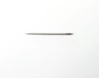 May include: A thin, silver needle with a pointed tip.