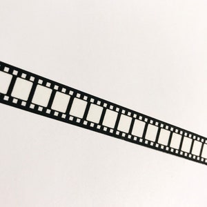 May include: Black and white film strip border on a white background.