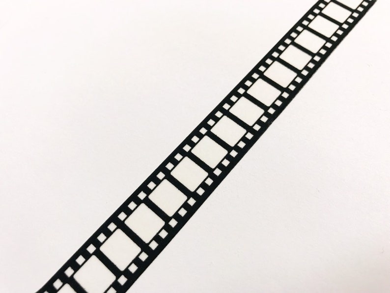 May include: Black and white film strip tape. The tape has a repeating pattern of rectangular frames with black borders.
