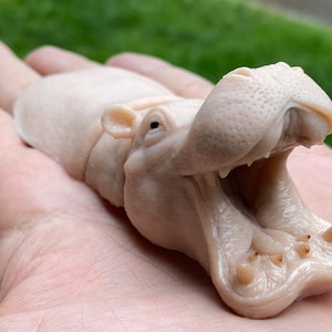 Deurstopper nijlpaard: beige nijlpaardbeeldhouwwerk
