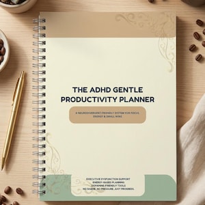 May include: A spiral-bound planner with a cream cover featuring the text THE ADHD GENTLE PRODUCTIVITY PLANNER, A NEURODIVERGENT-FRIENDLY SYSTEM FOR FOCUS, ENERGY & SMALL WINS, and EXECUTIVE DYSFUNCTION SUPPORT, ENERGY-BASED PLANNING, DOPAMINE-FRIENDLY TOOLS, NO SHAME. NO PRESSURE. JUST PROGRESS.