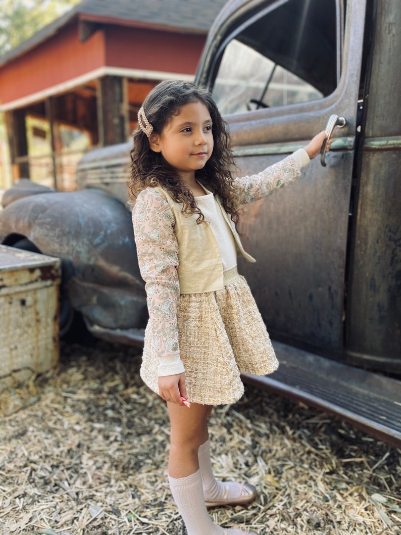 Girl\u2019s shimmer beige cropped jacket with Santa mesh sleeves