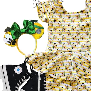 May include: Yellow and white striped outfit with a cartoon dog print. The outfit includes a short-sleeved top and shorts. The outfit is paired with black high-top sneakers and a green and yellow headband with a bow and a Pluto charm.