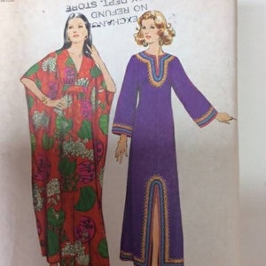 May include: A vintage sewing pattern for two long dresses. The dress on the left is red with a floral print and the dress on the right is purple with gold trim. The pattern is for sizes 8-10 and is from Simplicity pattern number 100.