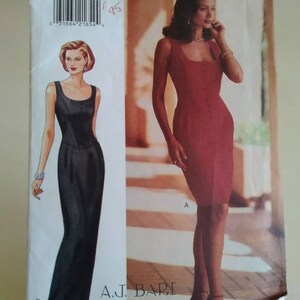 May include: A vintage Butterick sewing pattern, featuring illustrations of two elegant dresses. One is a floor-length black gown, and the other is a knee-length red dress. The pattern includes the text "4031" and "A.J. Bari".