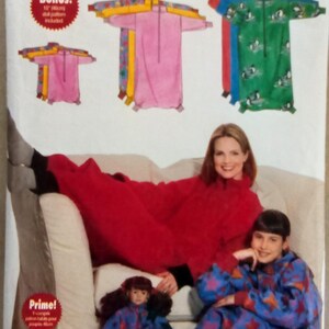 May include: Butterick sewing pattern envelope featuring a "Mother & Daughter" design. The cover shows illustrations of matching pajamas in pink, green, and blue. A woman and child are wearing the pajamas. The pattern includes all sizes in one envelope.