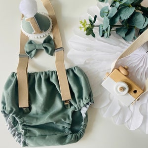 Handmade Sage Green Baby Boy Cake Smash Outfit: Shorts, Bow Tie, Braces, Hat.