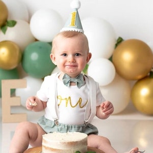 Baby Boys Cake Smash Outfit. 1st birthday set. Sage Green and gold Fabric/ white. Bow tie, braces, hat, nappy/diaper cover. Neutral, spring image 3