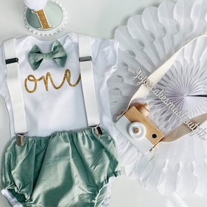 Baby Boys Cake Smash Outfit. 1st birthday set. Sage Green and gold Fabric/ white. Bow tie, braces, hat, nappy/diaper cover. Neutral, spring image 1