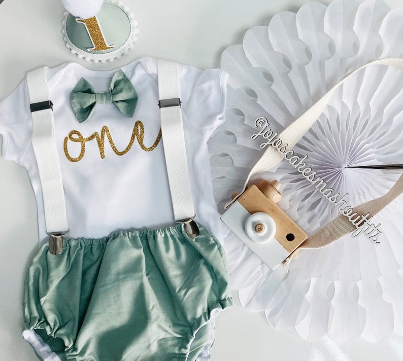 Baby Boys Cake Smash Outfit. 1st birthday set. Sage Green and gold Fabric/ white. Bow tie, braces, hat, nappy/diaper cover. Neutral, spring image 1