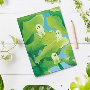 May include: A digital illustration of three white ghosts sitting on large green leaves against a blue sky background.
