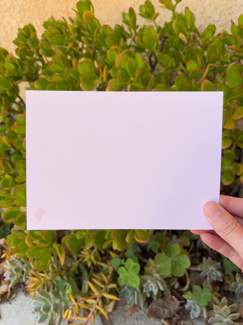 May include: A blank white card with a pink pencil icon in the bottom left corner.