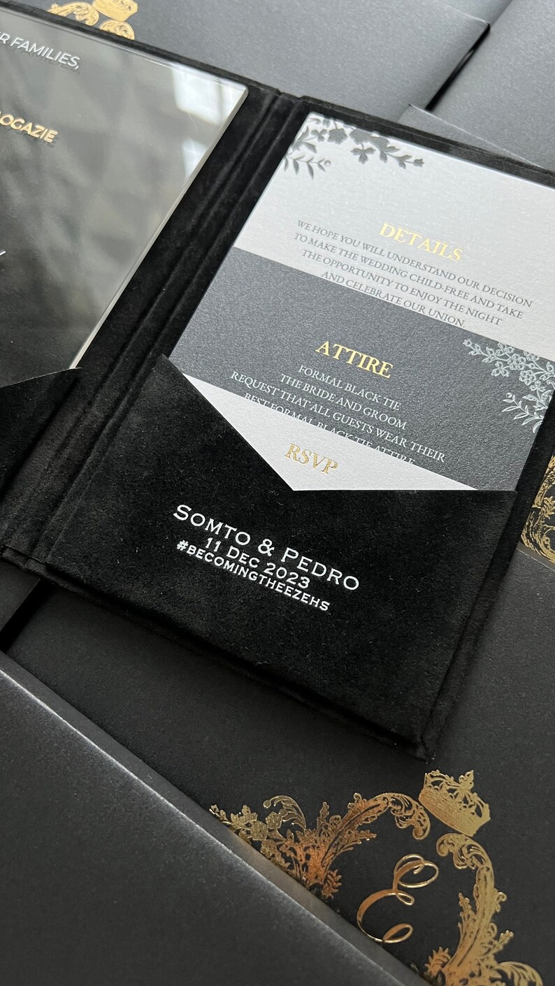 May include: A black and white wedding invitation with gold accents. The invitation features the text "Details", "Attire", "RSVP", "Somto & Pedro", "11 Dec 2023", and "#BecomingTheezehs".