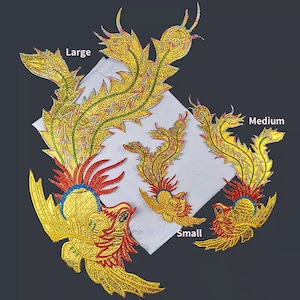 May include: Three embroidered iron-on patches in the shape of a phoenix, with gold, red, and yellow colors. The patches are labeled "Large", "Medium", and "Small".
