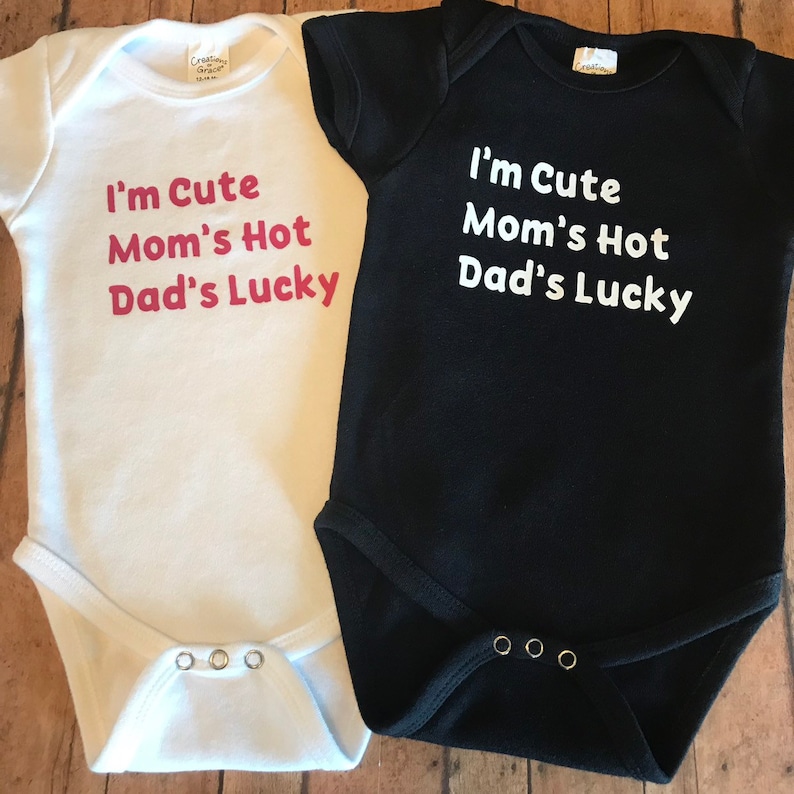 Trendy baby bodysuit available in multi colors! Dad/'s LUCKY I/'m CUTE Funny Baby Bodysuit for your new little one Mom/'s HOT