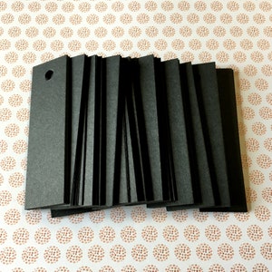 Etiquetas negras (100). Etiquetas en blanco de 1" x 3,5" para lazos de panadero, etiquetas de precio de joyería de tamaño mediano o grande, productos, obsequios, suministros comerciales, etiquetas de artículos