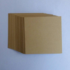 May include: A stack of brown cardstock paper, perfect for crafting and scrapbooking.