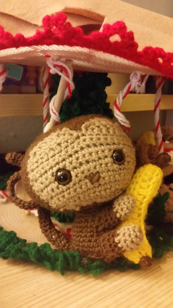 stuffed monkey with banana in hand