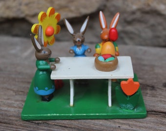 Easter bunny figurine group of rabbits at the table with flowers wood vintage Erzgebirge