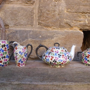 4 pcs. set teapot sugar bowl 2 milk jugs colorful and golden flowers Schumann Bavaria and other porcelain 30s Germany