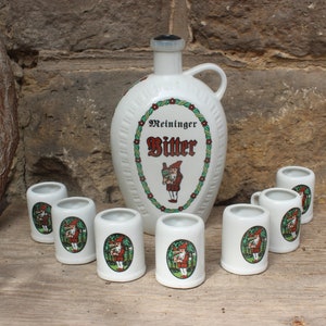 8 pcs. Set schnapps bottle (empty) + 7 schnapps cups Meininger Bitter Magenbitter Wagner & Apel Porcelain Vintage DDR GDR