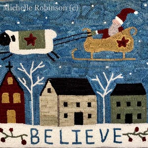 May include: A folk art rug depicting a Christmas scene. Santa Claus in a sleigh pulled by a sheep flies over a village with houses and a church. The word "BELIEVE" is at the bottom. The artist's name, Michelle Robinson, is at the top.