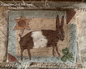 Wandering Rabbit, design by Dru Ann Jeffries of Cinnamon Creek Folk Art, offered as a rug hooking pattern by Star Rug Company.