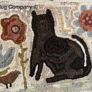 May include: A black cat sitting in a field of flowers. The cat is surrounded by brown, green, and blue flowers. The background is a cream color. The text "Star Rug Company" is in the top left corner of the image.