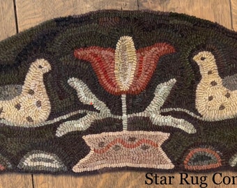 May include: A brown, cream, and green hooked rug in the shape of a half-circle. The rug features two stylized animals, a flower, and a pot. The rug is signed "Star Rug Company (c)".