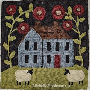 May include: A needlepoint rug depicting a blue house with red doors and windows, surrounded by green grass and two white sheep. The house is set against a black background with red flowers and green vines.