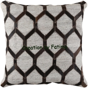 May include: A decorative throw pillow with a geometric pattern of brown leather squares on a light gray fabric background. The pillow has a subtle sheen and a textured surface. The text "Creation by Fatima" is printed in the center of the pillow.