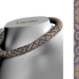May include: A close-up of a beaded necklace with a blue and gold pattern. The necklace is on a mannequin's neck. The text "© Jane Junker" is visible in the image.