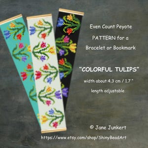Könnte beinhalten: Drei Perlenmuster mit bunten Tulpendesigns. Die Muster sind in Türkis, Off-White und Schwarz gehalten, mit dem Text "COLORFUL TULIPS". Die Breite beträgt ca. 4,3 cm, und die Länge ist verstellbar.