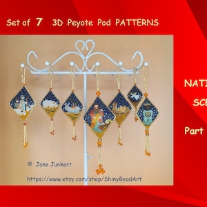 May include: Set of seven 3D peyote pod patterns for beading a nativity scene. The patterns are displayed on a white stand with gold tassels. The text "Nativity Scene Part 1 - 7" is visible in the image.