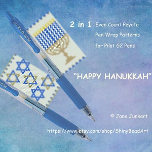 May include: Two blue Pilot G2 pens with instructions for making a peyote stitch pen wrap. The designs are for a menorah and a Star of David. The text reads "2 in 1 Even Count Peyote Pen Wrap Patterns for Pilot G2 Pens" and "HAPPY HANUKKAH".