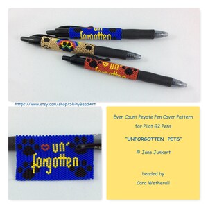 May include: A close-up of a beaded pen cover pattern with the text "Unforgotten Pets" in yellow letters on a blue background. The pattern is made with black and white beads and features paw prints. The pen cover is designed for Pilot G2 pens.