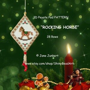 May include: A white and red beaded bauble with a rocking horse design. The bauble is a 3D peyote pod pattern with 28 rows. The text "Rocking Horse" is printed on the bauble. The bauble is hanging from a string and is surrounded by a green background.