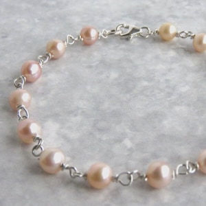 925 Sterling Silver Genuine Peach And Lavender Freshwater Pearl Bracelet.