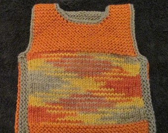 Cute orange sweater vest with intricate inset