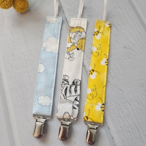 Winnie the pooh themed pacifier clip set