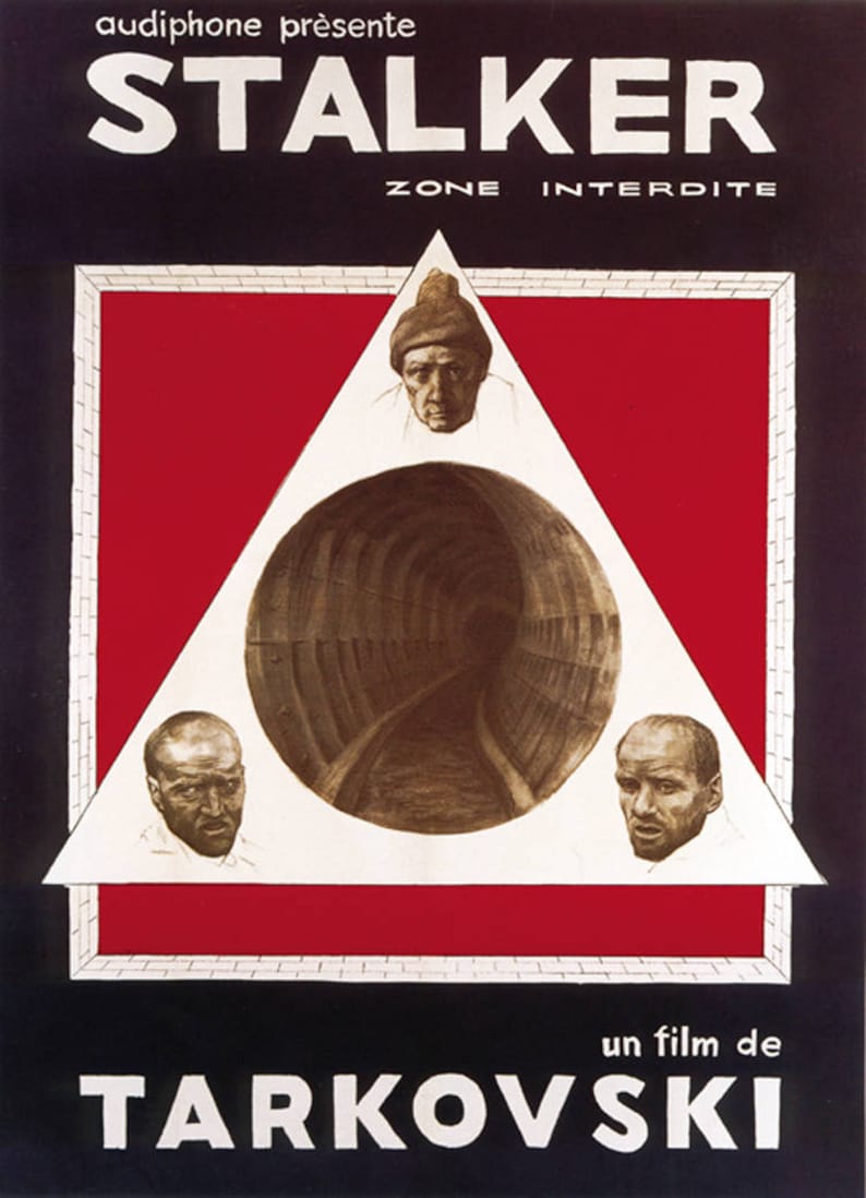 May include: A black and white poster for the film "STALKER" by Andrei Tarkovsky. The poster features a white triangle with three faces inside, a tunnel, and the text "ZONE INTERDITE" and "un film de TARKOVSKI".
