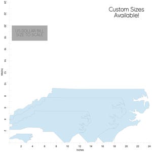 May include: Light blue map outlines of North Carolina, with a scale showing inches. The text "US DOLLAR BILL SIZE TO SCALE" is present. The text "Custom Sizes Available!" is also visible.