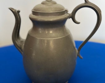 A drum-waisted copper and tin pot cultural relic.