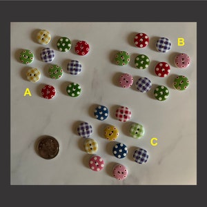 May include: Assortment of colourful buttons with various patterns, including polka dots, gingham, and floral designs. The buttons are arranged in three groups labelled A, B, and C.