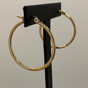 May include: A rustic wooden sign with the text "Welcome to our home" in white lettering. The sign features a distressed finish and a simple, inviting design, perfect for entryway decor.