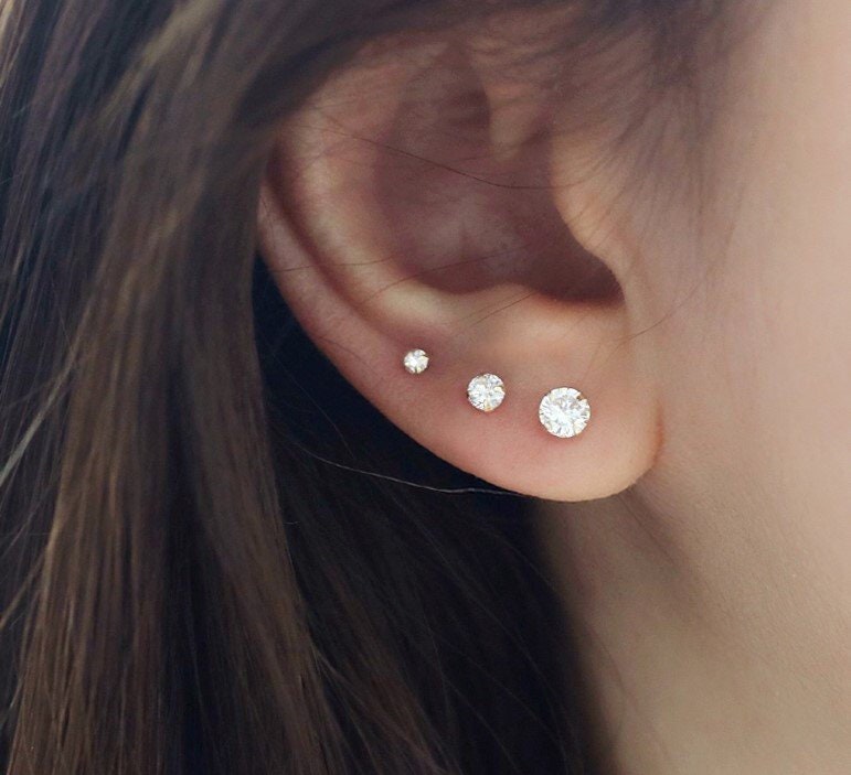 Three ear piercings and cartilage sale
