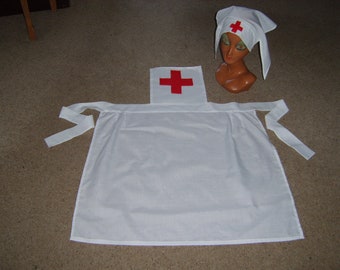May include: A white nurse's costume with a red cross on the chest and a matching hat. The costume has two long ties that can be tied at the waist.
