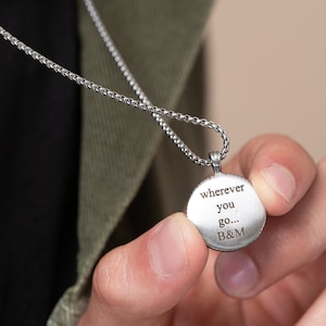 May include: Silver necklace with a round pendant that says "wherever you go... B&M".