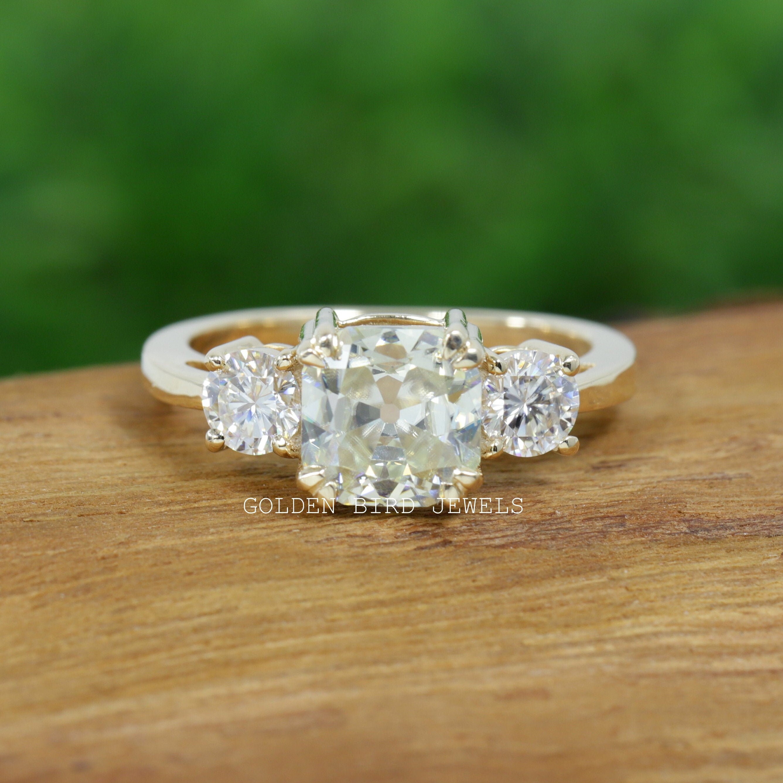 Cushion cut on sale three stone ring
