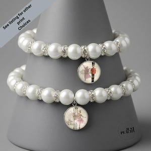 Set di gioielli elasticizzati in argento con ciondoli a tema balletto, schiaccianoci, danza natalizia e arte con perle.